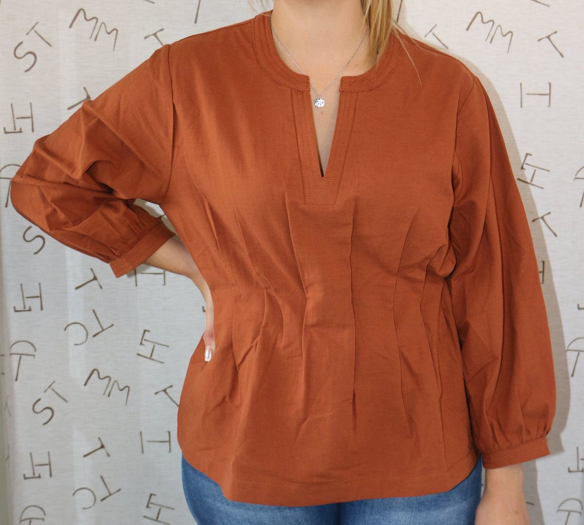Caramel V-Neck Pintuck